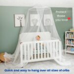 Child in a crib under a mosquito net